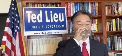 Rep. Ted Lieu drinks a glass of water.