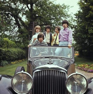 The Rolling Stones in a vintage car, 1964