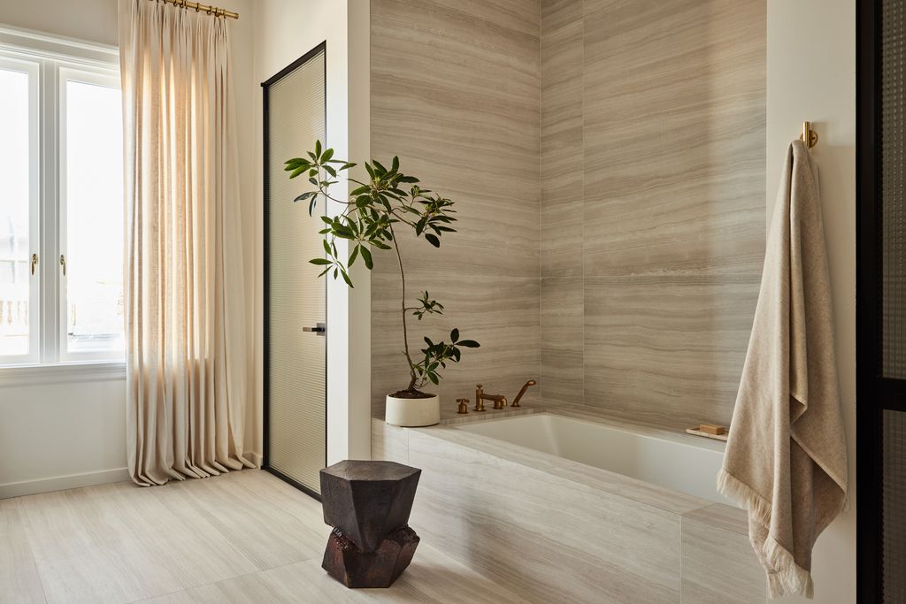 This travertine bathroom has convinced me that this material is literally perfect