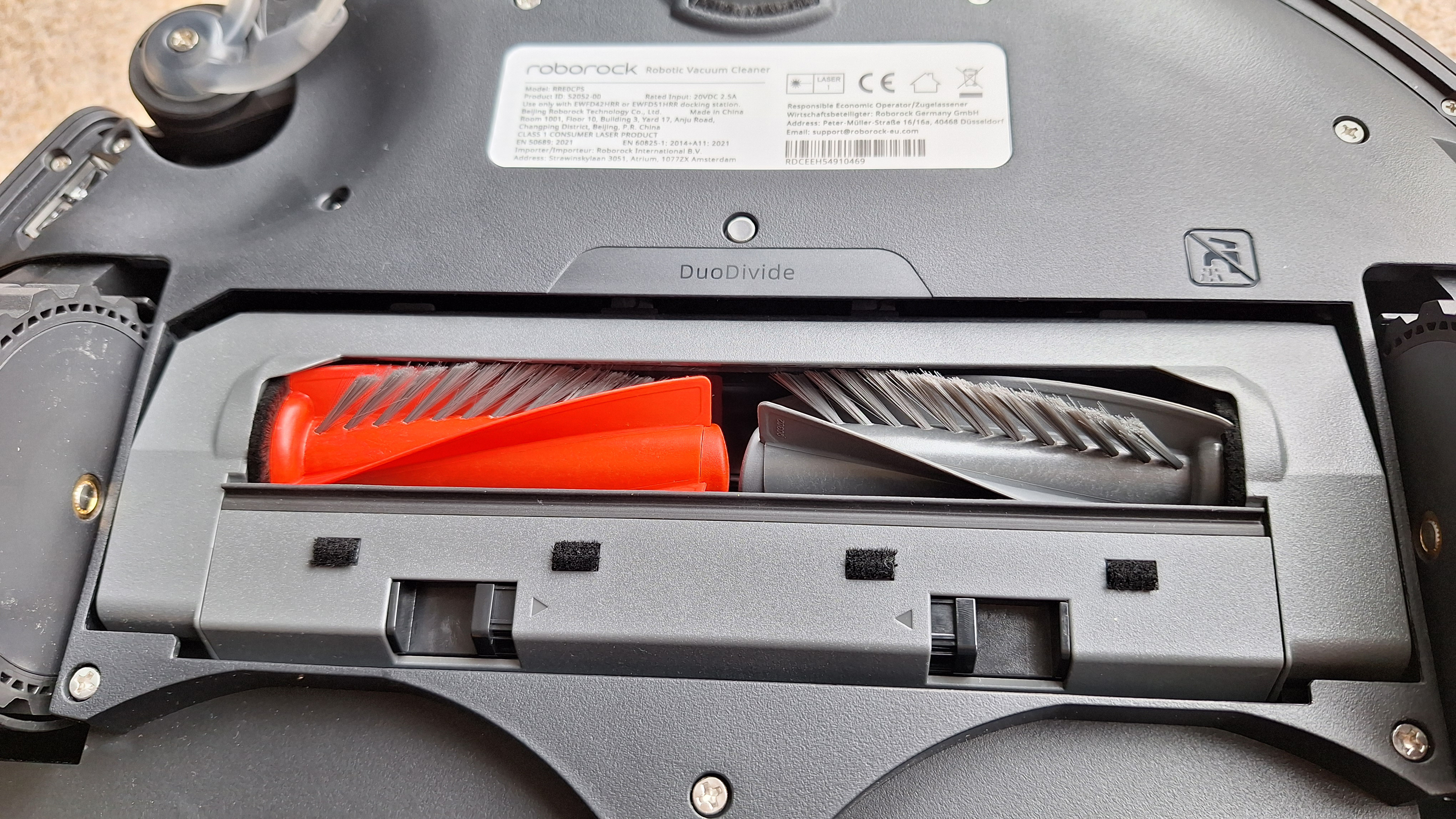 Roborock Saros 20 robot vacuum flipped over to show rollers