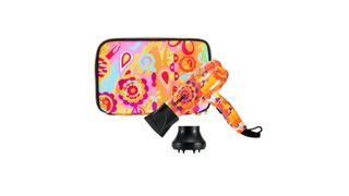 A orange and pink printed Amika Mighty Mini hair dryer with a matching travelling case.