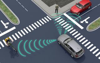 Autonomous car at an intersection with its sensors beaming their signal