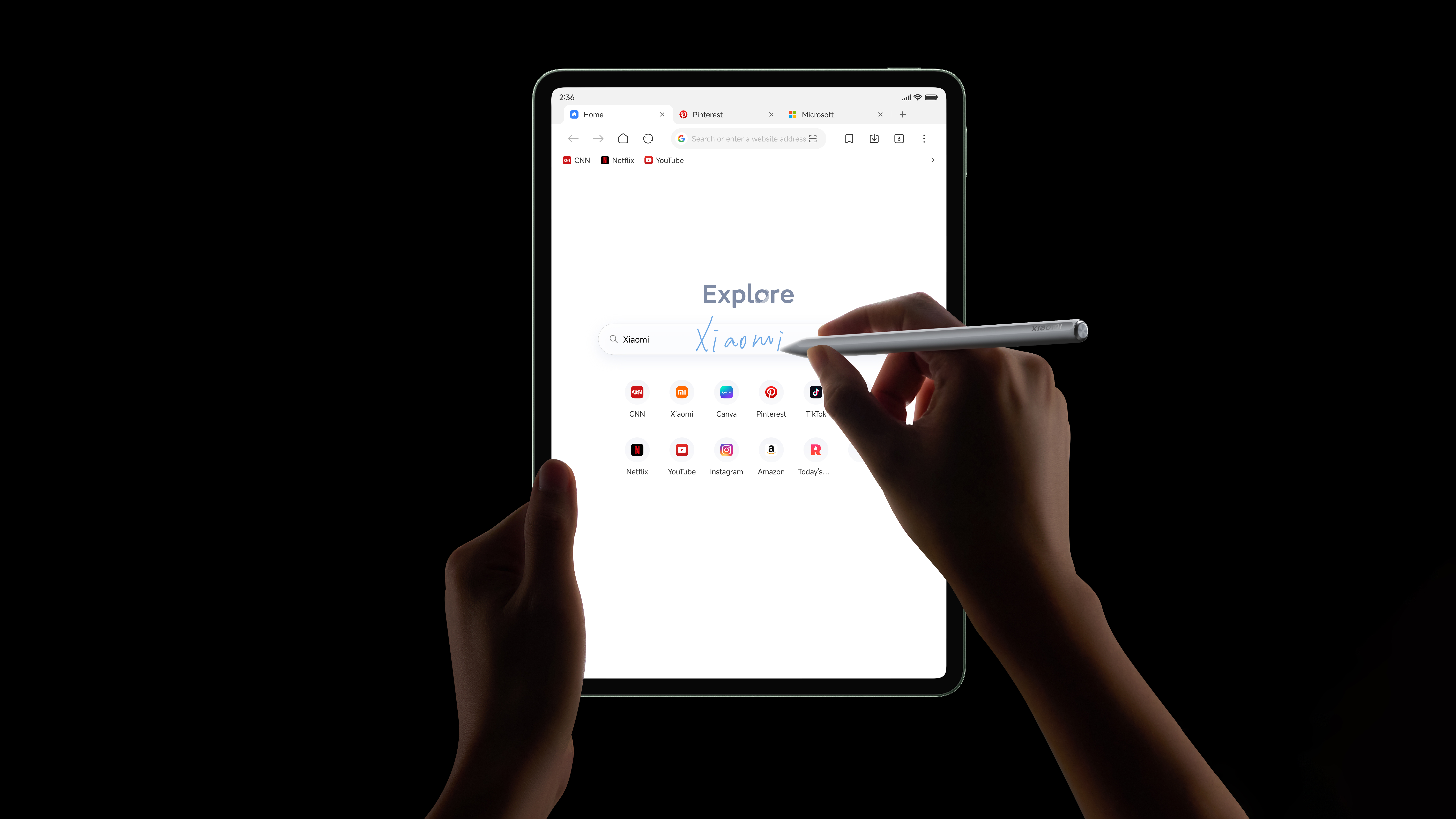 Xiaomi Pad 8 Pro tablet held in a pair of hands writing on the screen with a stylus