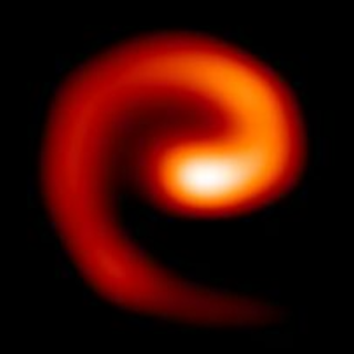 An orange and red swirl against a black background