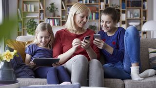 Best internet filter software 2022: image shows family using tabletsk