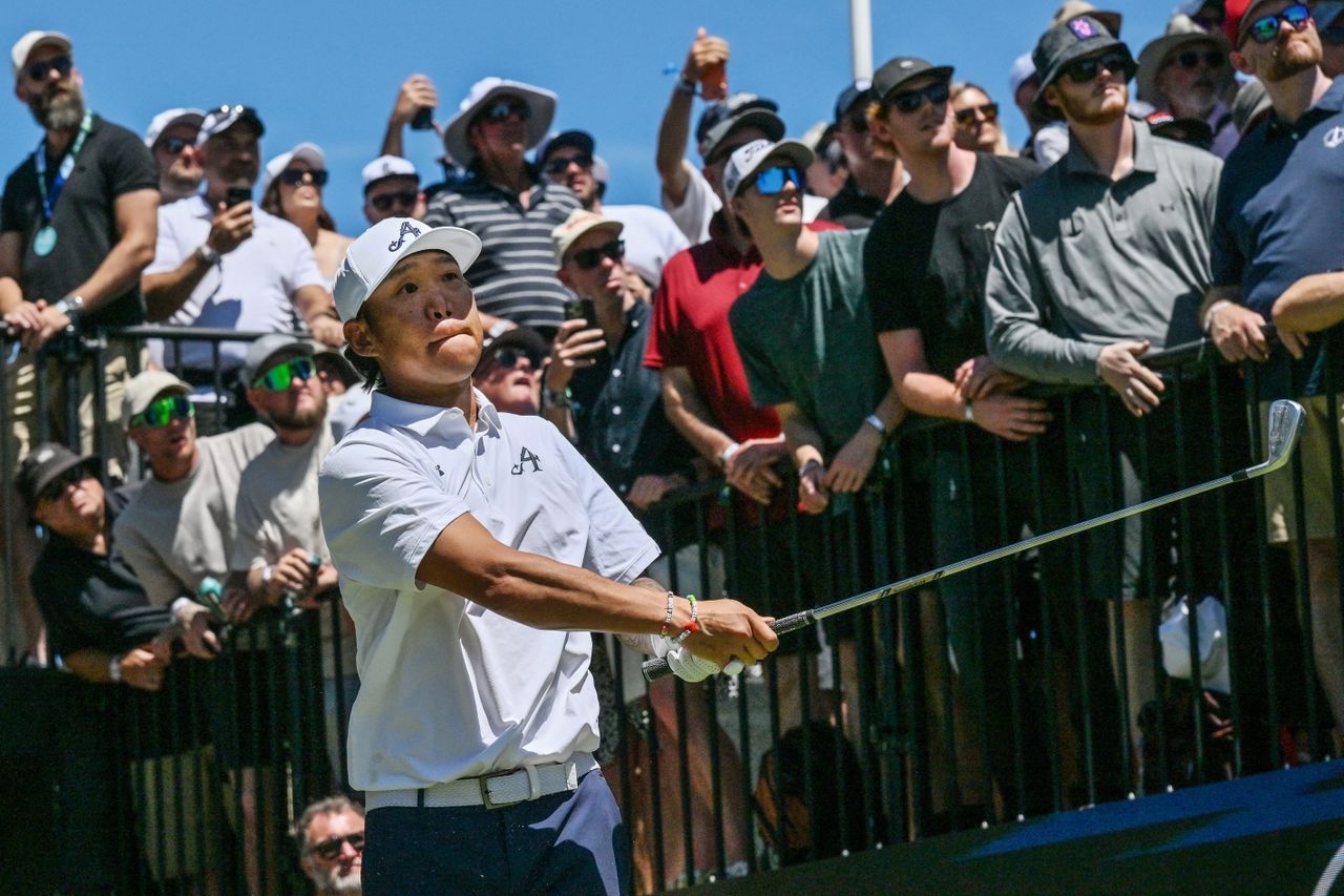 Anthony Kim hits an iron off the tee