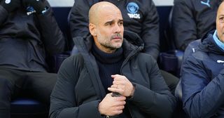 Pep Guardiola, Manager of Manchester City, looks on prior to the Premier League match between Tottenham Hotspur and Manchester City at Tottenham Hotspur Stadium on February 05, 2023 in London, England.