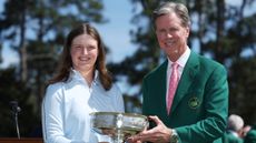 Fred Ridley hands Lottie Woad the Augusta National Women's Amateur trophy