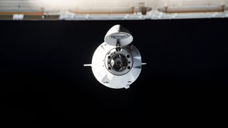 a spacex dragon capsule approaches the international space station