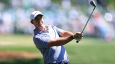 Rory McIlroy of Northern Ireland hits his second shot on the 1st hole during the third round of the 2026 Masters Tournament at Augusta National Golf Club on April 11, 2026 in Augusta, Georgia.