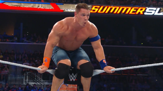 John Cena with his shirt off and jorts on gets ready to jump off the ropes.