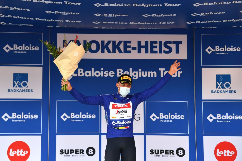 KNOKKEHEIST BELGIUM JUNE 16 Mads Pedersen of Denmark and Team Trek Segafredo blue leader jersey celebrates at podium during the 91st Baloise Belgium Tour 2022 Stage 2 a 1756km stage from Beveren to KnokkeHeist BaloiseBelgiumTour on June 16 2022 in KnokkeHeist Belgium Photo by Luc ClaessenGetty Images