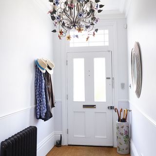 hall way wth white wall and door