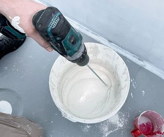 using electric drill to mix cement
