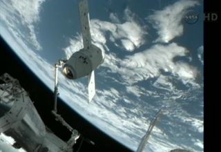 The Canadarm2 of the International Space Station was used to position the Dragon spacecraft for docking, May 25, 2012.