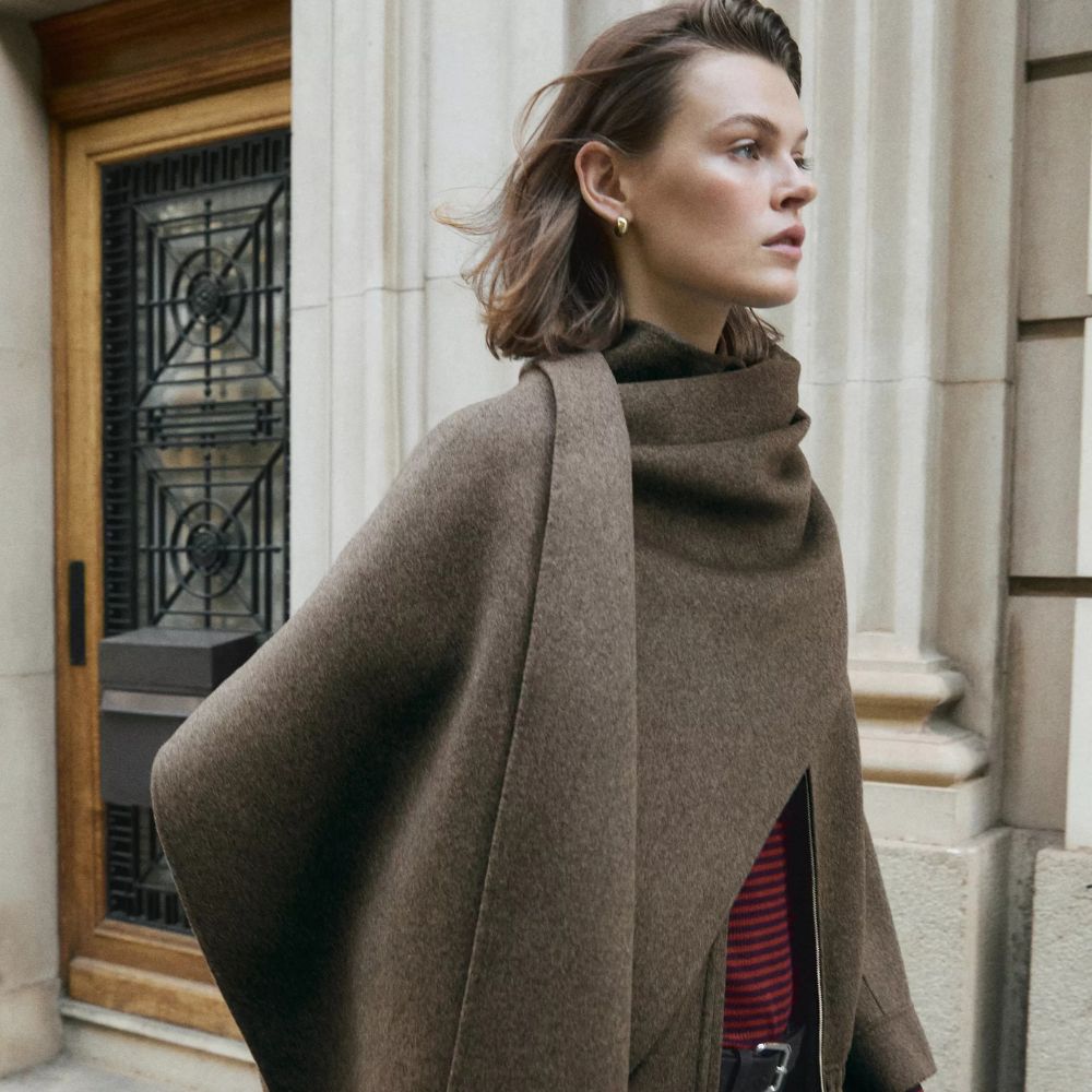 model wearing brown funnel neck COS jacket