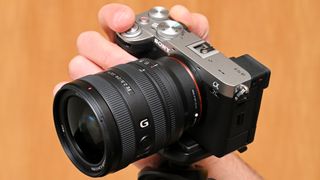 A photograph of the Sony A7C II in hand