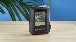 A black Leica Sofort 2 hybrid instant camera