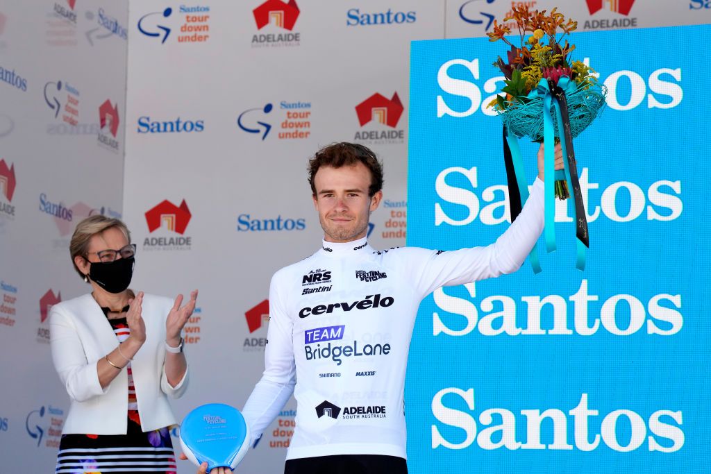 WILLUNGA HILL AUSTRALIA JANUARY 29 Matt Dinham of Australia and Team Bridgelane on second place poses on the final podium ceremony after the 2nd Santos Festival Of Cycling 2022 Mens Elite Stage 3 a 1132km stage from McLaren Vale to Willunga Hill 224m TourDownUnder on January 29 2022 in Willunga Hill Australia Photo by Daniel KaliszGetty Images