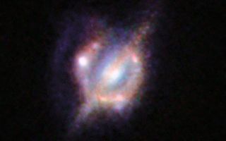 The NASA/ESA Hubble Space Telescope and many other telescopes on the ground and in space have been used to obtain the best view yet of a collision that took place between two galaxies when the Universe was only half its current age.