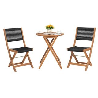 A wooden bistro set with black woven accents on the chairs