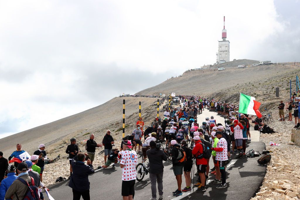 MALAUCENE FRANCE JULY 07 The peloton passing through Mont Ventoux 1910m mountain landscape during the 108th Tour de France 2021 Stage 11 a 1989km km stage from Sorgues to Malaucne Fog Public Fans LeTour TDF2021 on July 07 2021 in Malaucene France Photo by Michael SteeleGetty Images