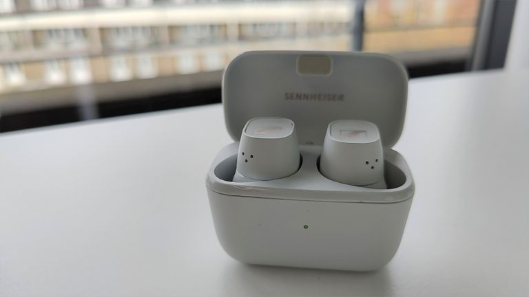 Sennheiser CX Plus True Wireless review: man smiling with headphones in