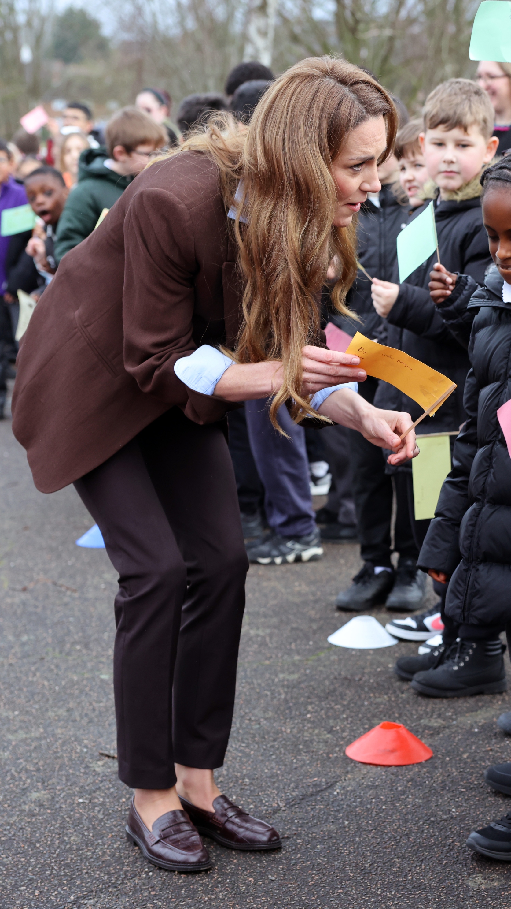 Catherine, Princess Of Wales speaks to children as she visits Castle Hill Academy in New Addington, Croydon