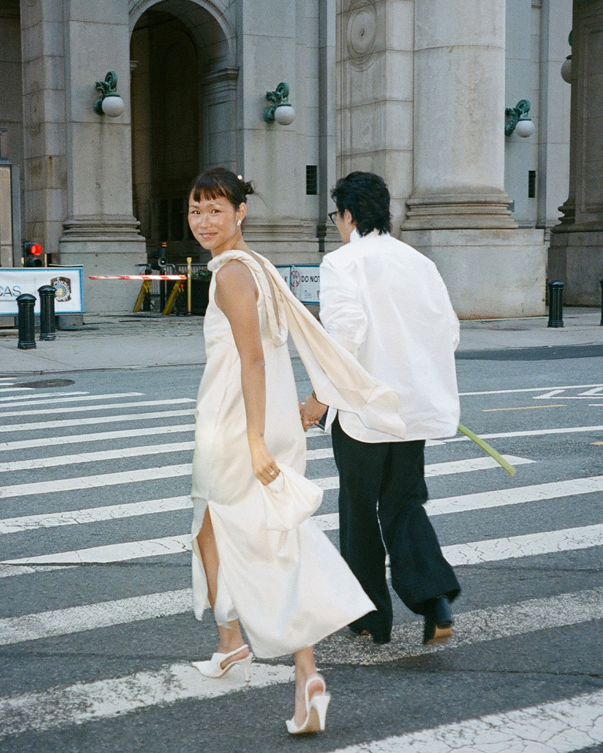 Trisha and Gui in NYC wearing city hall ceremony outfits.