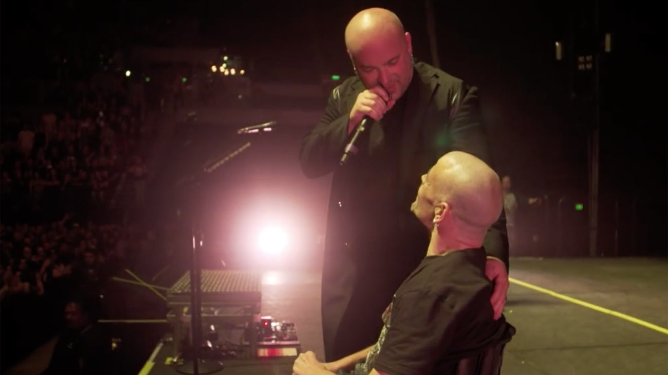 A picture of David Draiman and Disturbed fan Pete in Auckland