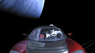 A screengrab from the SpaceX live feed shows the Roadster leaving Earth behind.