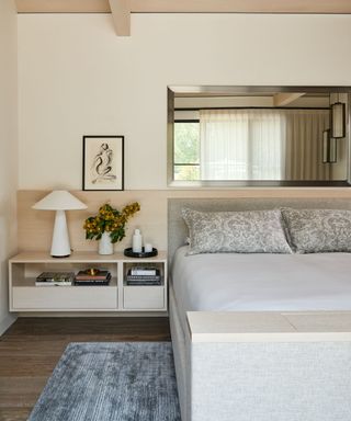 neutral bedroom with a hidden tv in the base of the bed