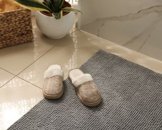 Bathroom with gray bath and slippers