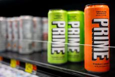 Prime energy drinks are displayed for sale on shelves 