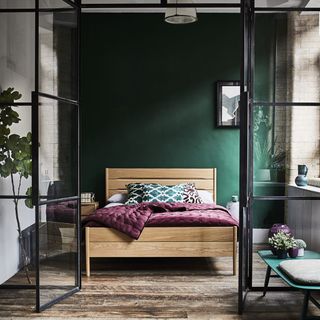 Bedroom with a Crittall style glass door divider