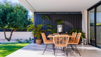 modern enclosed patio ideas with table and chairs