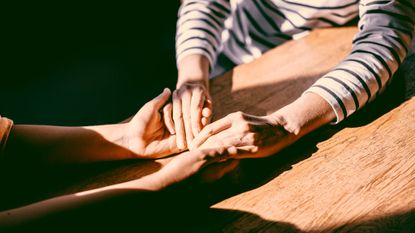 couple holding hands 