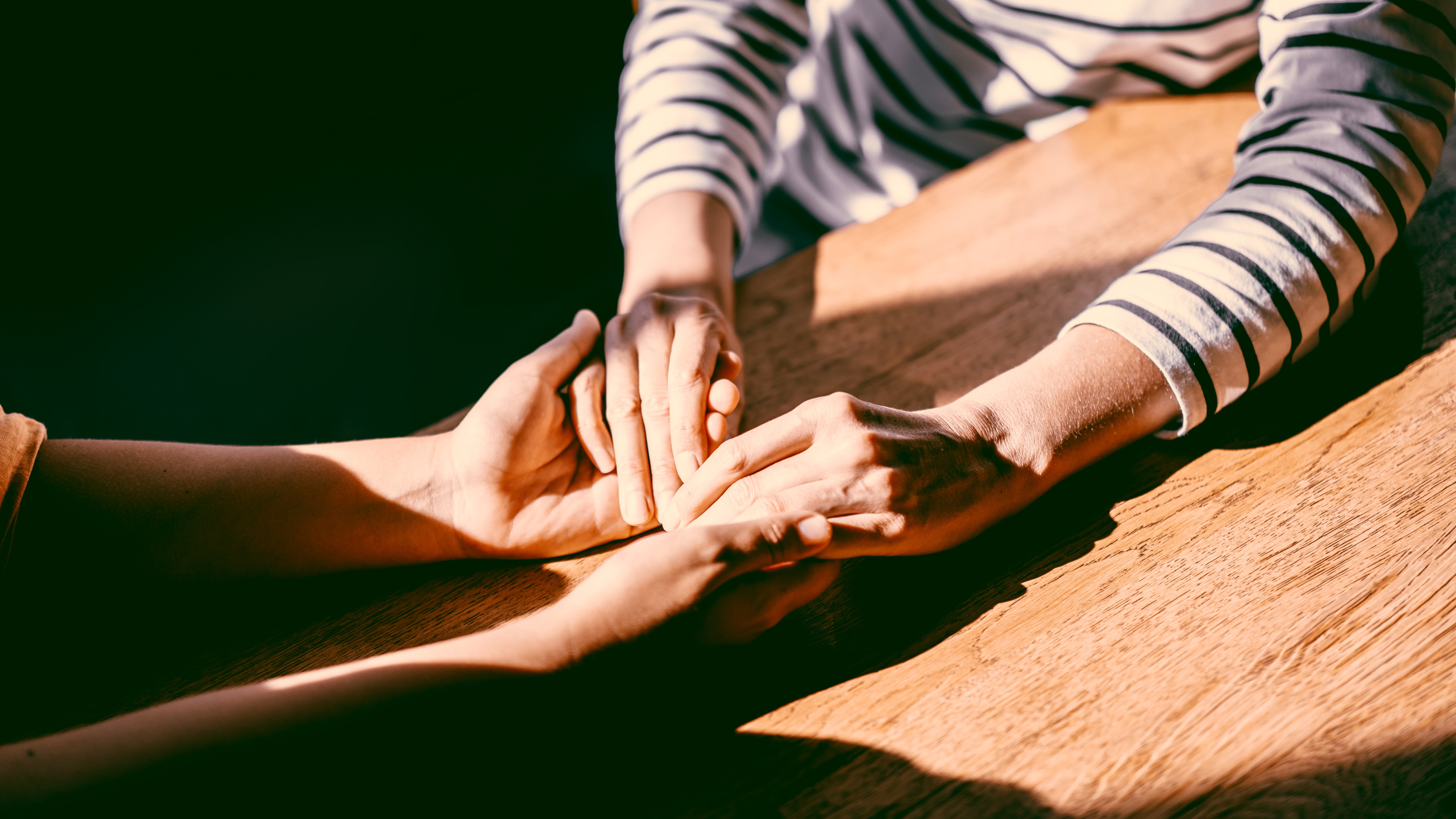 couple holding hands 
