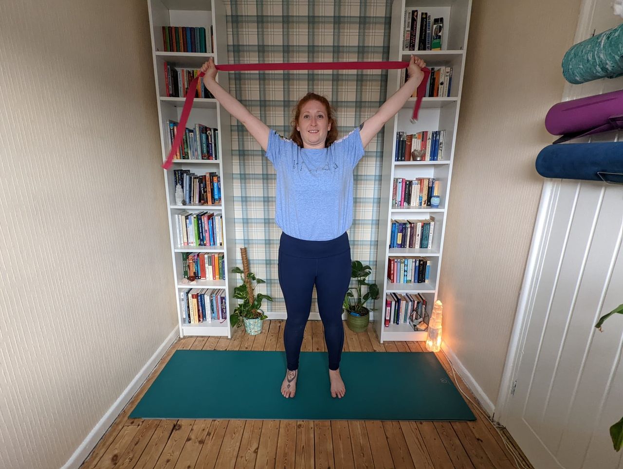 Woman doing flexibility exercises with resistance bands