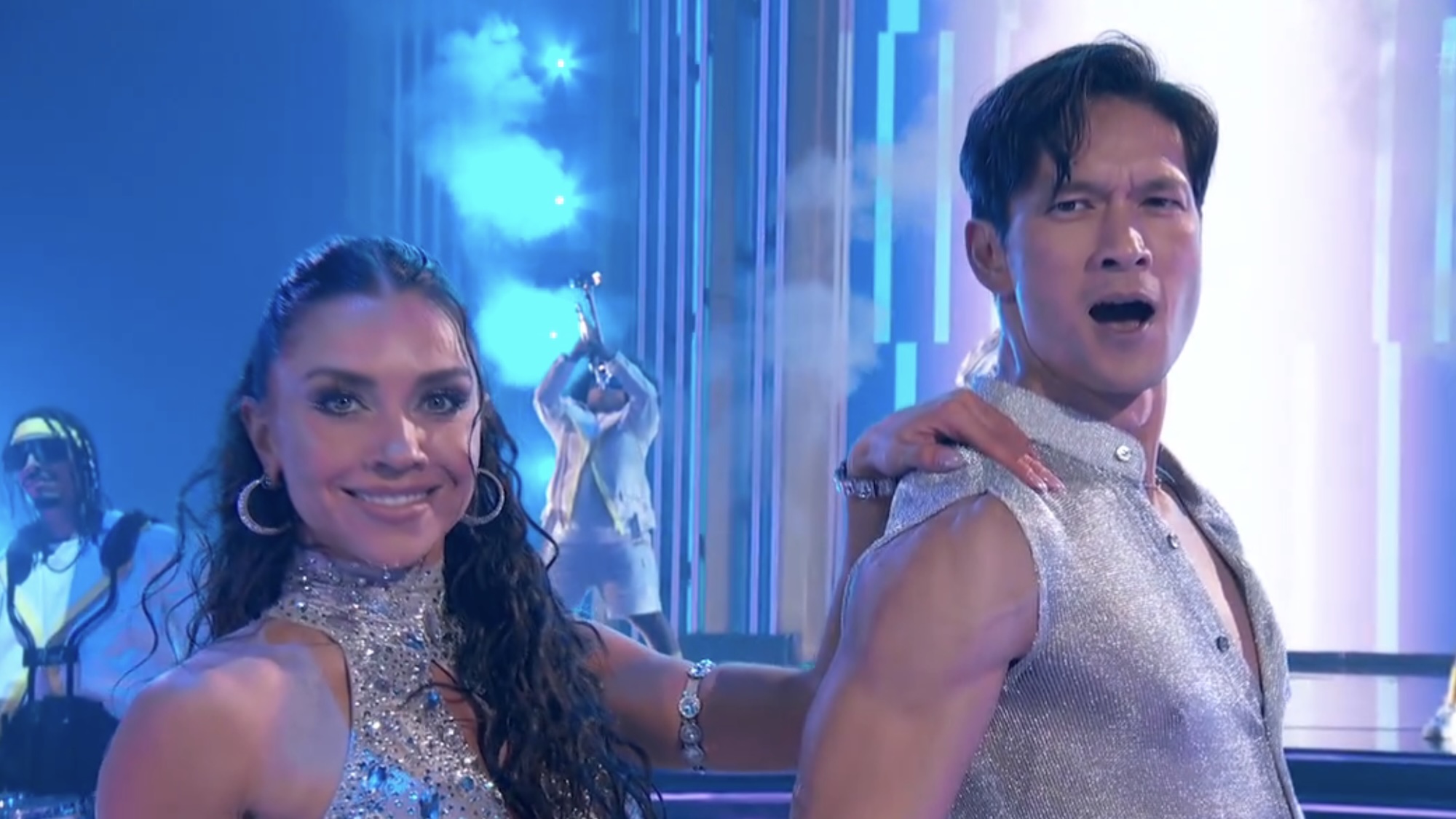 Harry Shum Jr. and Jenna Johnson hitting their last pose in silver costumes during DWTS Super Bowl night. 