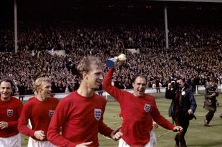 England’s George Cohen, Bobby Moore, Jack Charlton and Ray Wilson, with trophy, celebrate after winning the World Cup in 1966