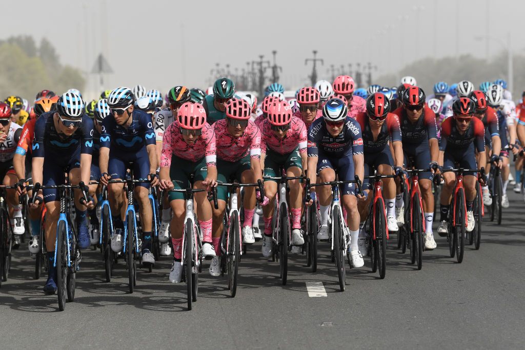 ABU DHABI UNITED ARAB EMIRATES FEBRUARY 21 LR Carlos Verona Quintanilla of Spain and Movistar Team Sean Quinn of United States Ruben Guerreiro of Portugal Neilson Powless of United States and Team EF Education Easypost Scott Thwaites of United Kingdom and Team AlpecinFenix Michal Kwiatkowski of Poland and Team INEOS Grenadiers and the peloton compete during the 4th UAE Tour 2022 Stage 2 a 176km stage from Hudayriyat Island to Abu Dhabi Breakwater UAETour WorldTour on February 21 2022 in Abu Dhabi United Arab Emirates Photo by Tim de WaeleGetty Images