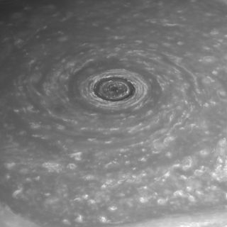 This photo shows Saturn's north polar vortex and hexagonal jet stream.