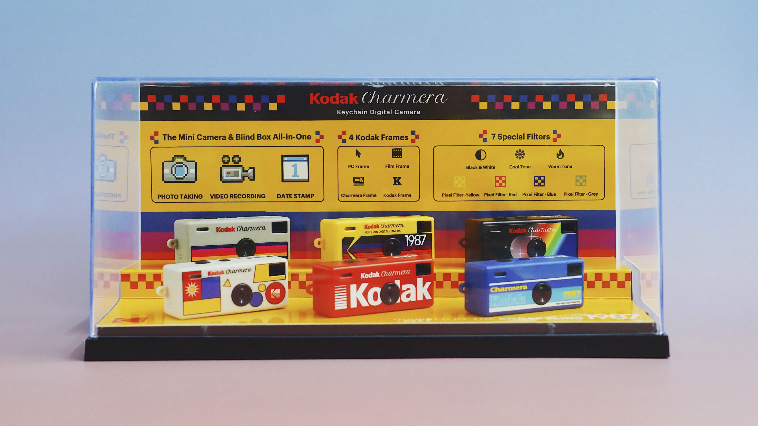 Kodak Charmera keyring camera in all six colorways in a presentation case, with studio lighting