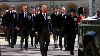 WINDSOR, ENGLAND - APRIL 17: Princess Anne, Princess Royal, Prince Charles, Prince of Wales, Prince Andrew, Duke of York, Prince Edward, Earl of Wessex, Prince William, Duke of Cambridge, Peter Phillips, Prince Harry, Duke of Sussex, Earl of Snowdon David Armstrong-Jones and Vice-Admiral Sir Timothy Laurence follow Prince Philip, Duke of Edinburgh's coffin during the Ceremonial Procession during the funeral of Prince Philip, Duke of Edinburgh at Windsor Castle on April 17, 2021 in Windsor, England. Prince Philip of Greece and Denmark was born 10 June 1921, in Greece. He served in the British Royal Navy and fought in WWII. He married the then Princess Elizabeth on 20 November 1947 and was created Duke of Edinburgh, Earl of Merioneth, and Baron Greenwich by King VI. He served as Prince Consort to Queen Elizabeth II until his death on April 9 2021, months short of his 100th birthday. His funeral takes place today at Windsor Castle with only 30 guests invited due to Coronavirus pandemic restrictions.