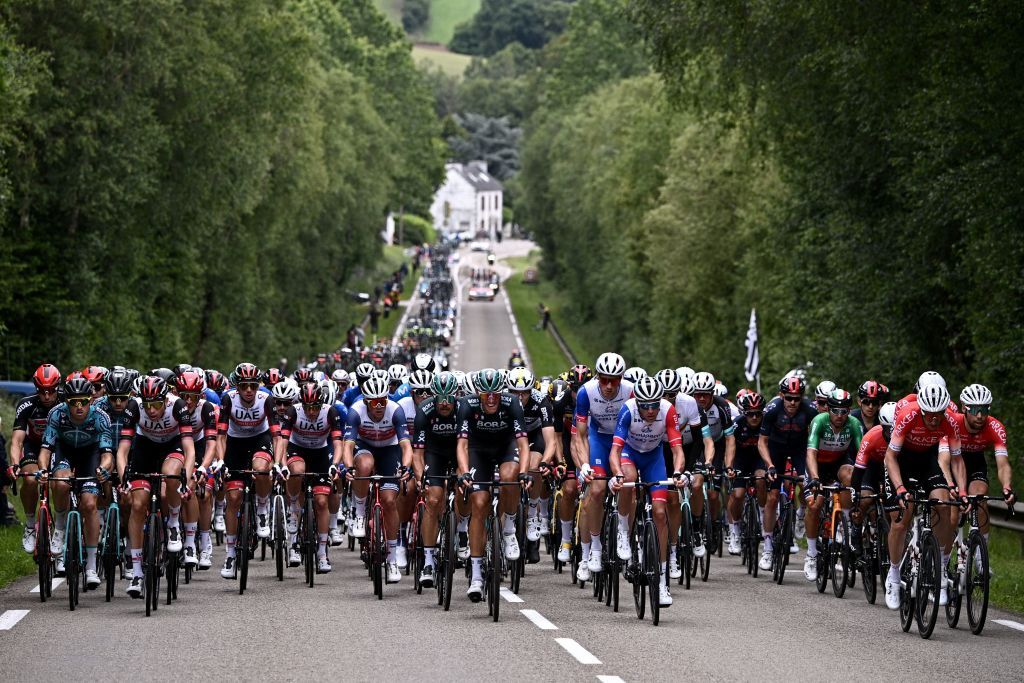 The pack rides during the 1st stage of the 108th edition of the Tour de France cycling race 197 km between Brest and Landerneau on June 26 2021 Photo by AnneChristine POUJOULAT AFP Photo by ANNECHRISTINE POUJOULATAFP via Getty Images
