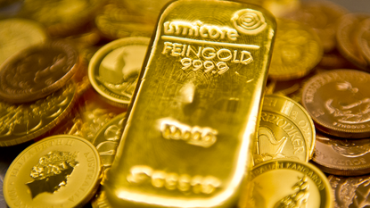Gold bars and coins © Photothek via Getty Images