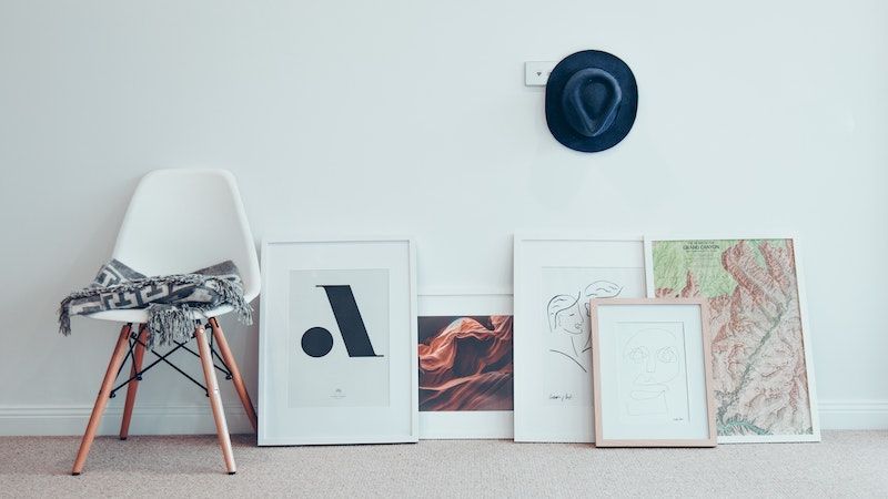 picture frames leaning against interior wall