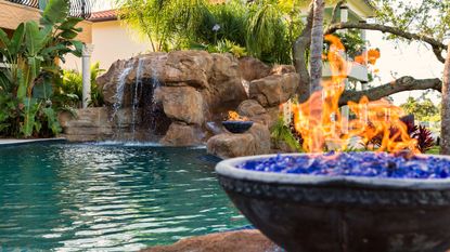 pool grotto with fire bowls