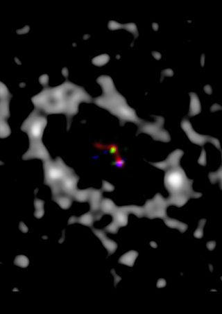 Adaptive optics observations from the Large Binocular Telescope and the Magellan Adaptive Optics System (color scale) show multiple sources in the cleared region of the LkCa 15 transition disk (gray scale).